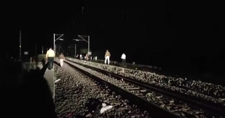 12 dead in India after train passengers fleeing fire jump onto tracks and hit by another train