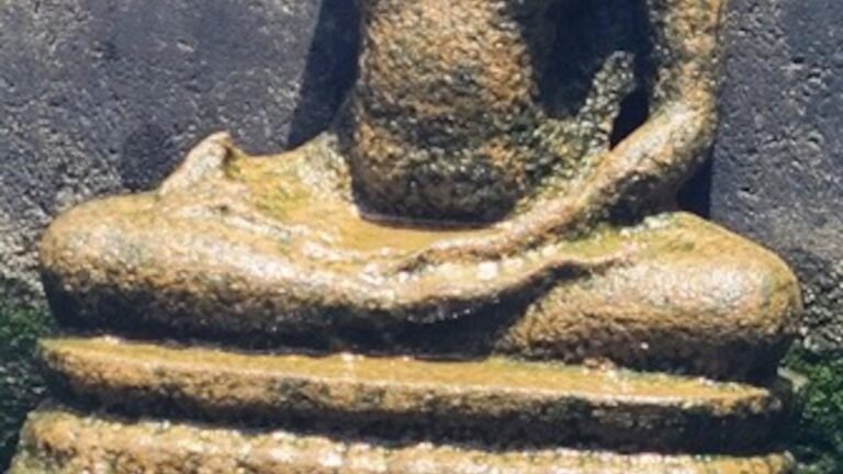 Headless statue of Buddha, three caves of rock cut caves found in Kadri in Mangalur