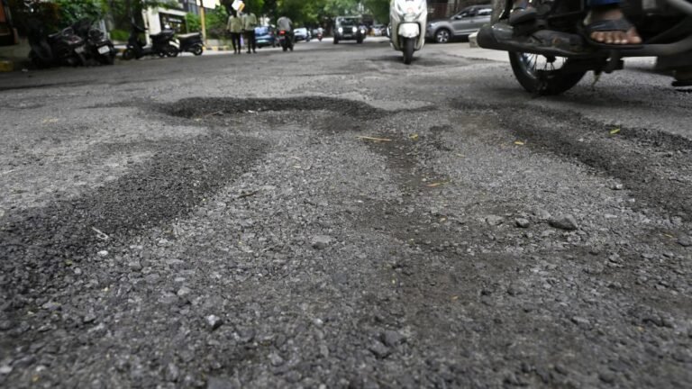 Rain Pain withdraws Agony Pothole for urban motorists and pedestrians