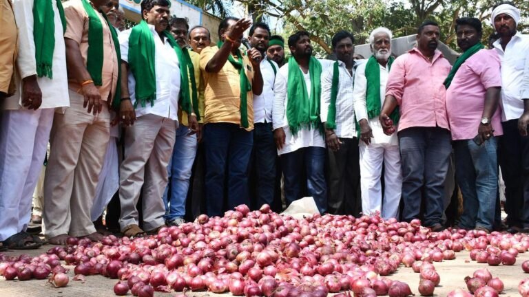 As the rains destroy the onion crop, farmers block the roads, strewing onions on the roads