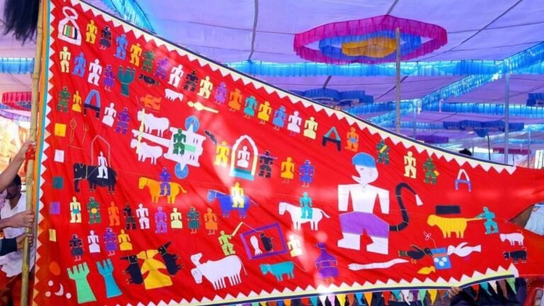 Carrying the flag of the Koya tribes and their stories