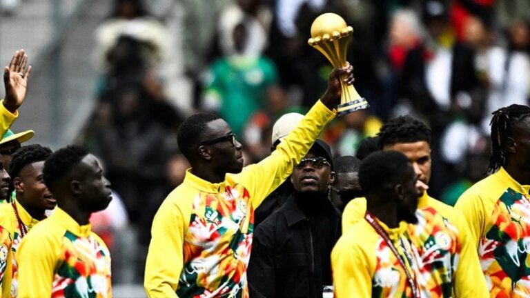 Senegal will show off the AFCON trophy as players defy controversial title strip challenge