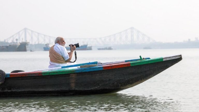 PM rides a boat on the Hooghly River in Kolkata and tries his hand at photography