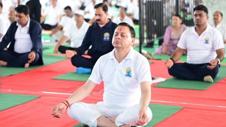Pushkar Singh Dhami performs yoga on International Yoga Day