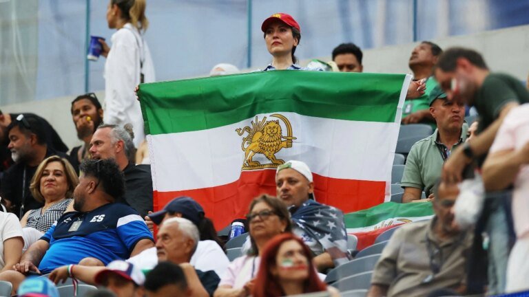 World Cup: Iran fans turn up in numbers with banned lion and sun flag