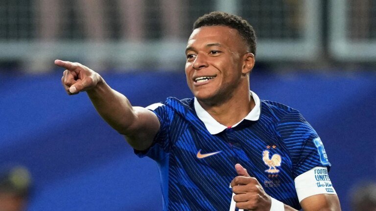 Mbappe keeps Messi at bay as France crush Iraq in weather-hit World Cup clash