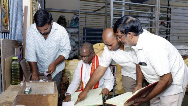 The temple president evaluates the cowshed and facilities for devotees