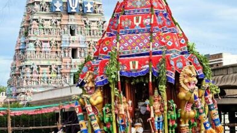 The umbrella on Sri Narasimhara’s chariot tilts during the procession