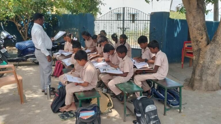 Students of a government high school attend classes under the shade of trees in Vellore after school buildings were demolished